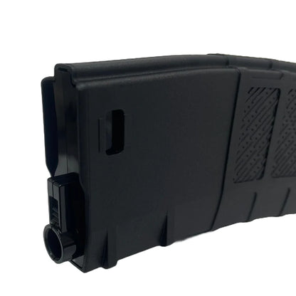 Black airsoft magazine on a white background, top view