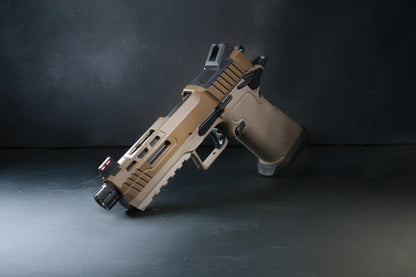 A semi-automatic airsoft pistol, identified as a Kizuna Works Basilisk shown on a dark, textured studio surface.